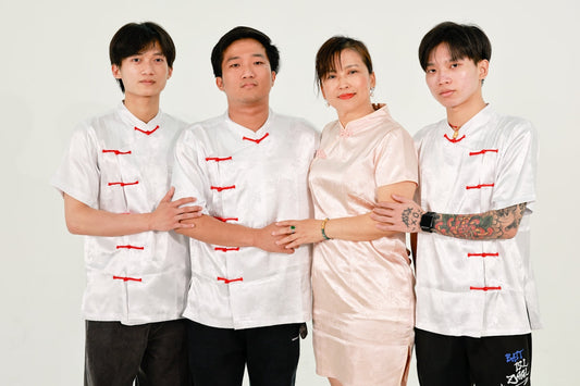 Family in traditional chinese clothing posing foral outfits